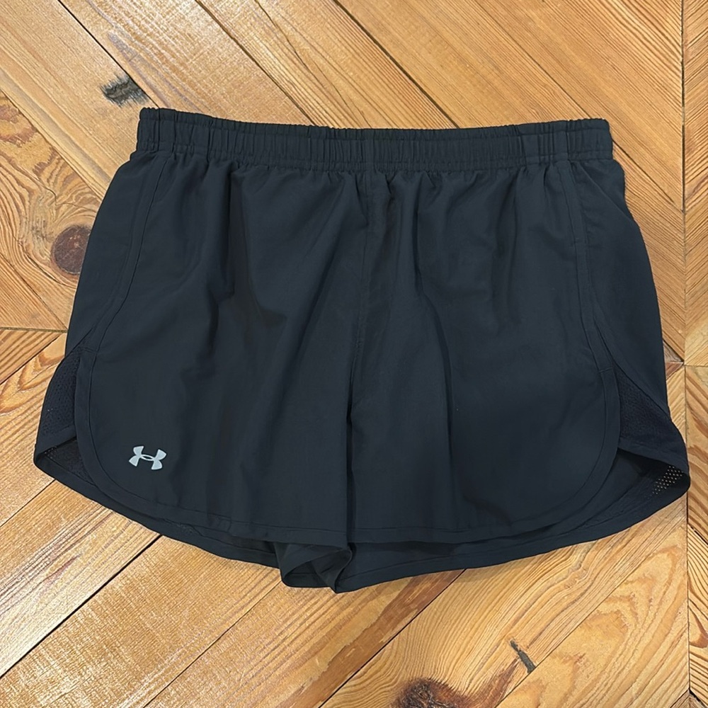 Women’s Under Armour heat gear shorts in medium.